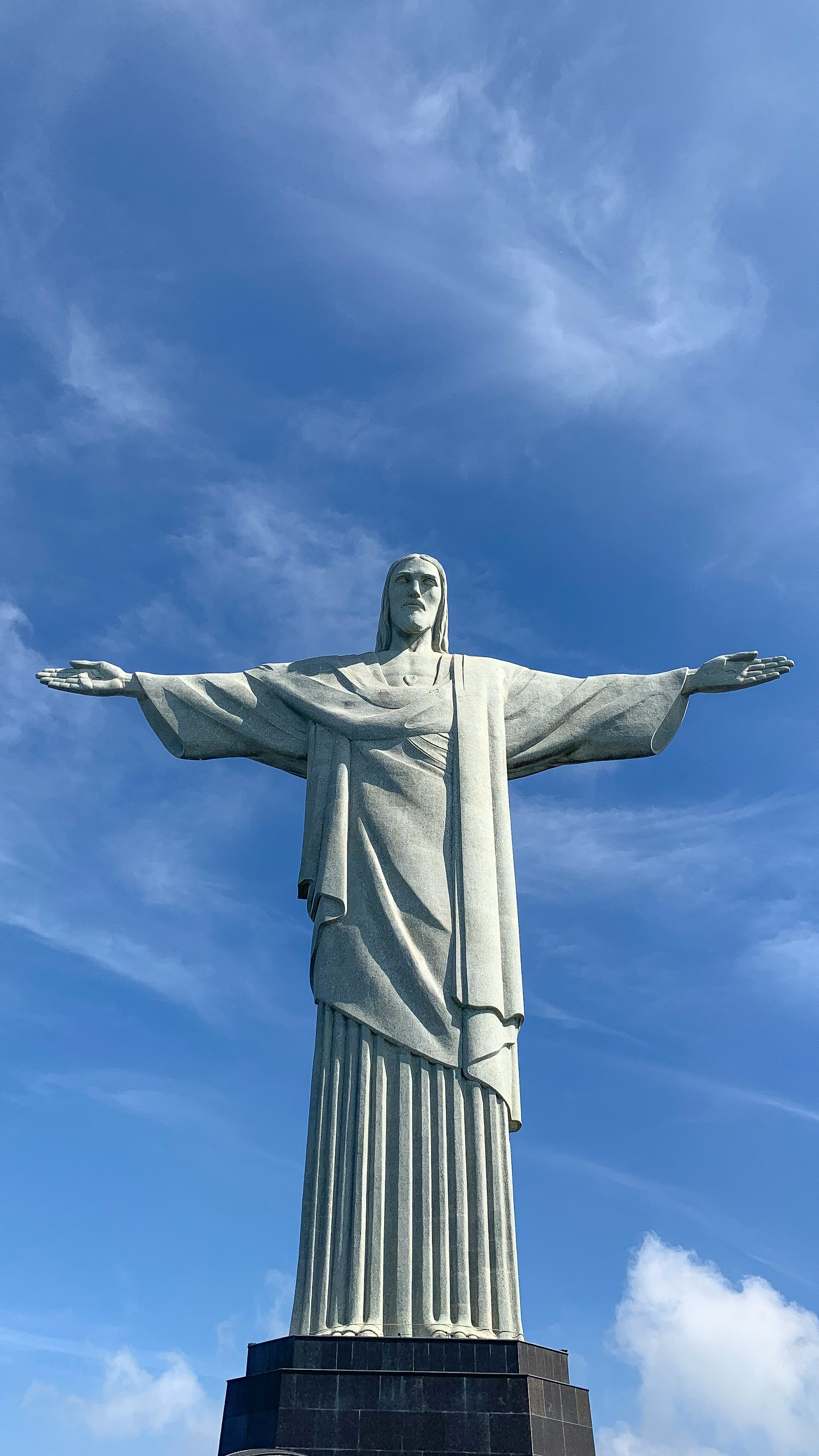 Christ the Redeemer statue overlooking Rio de Janeiro with arms outstretched